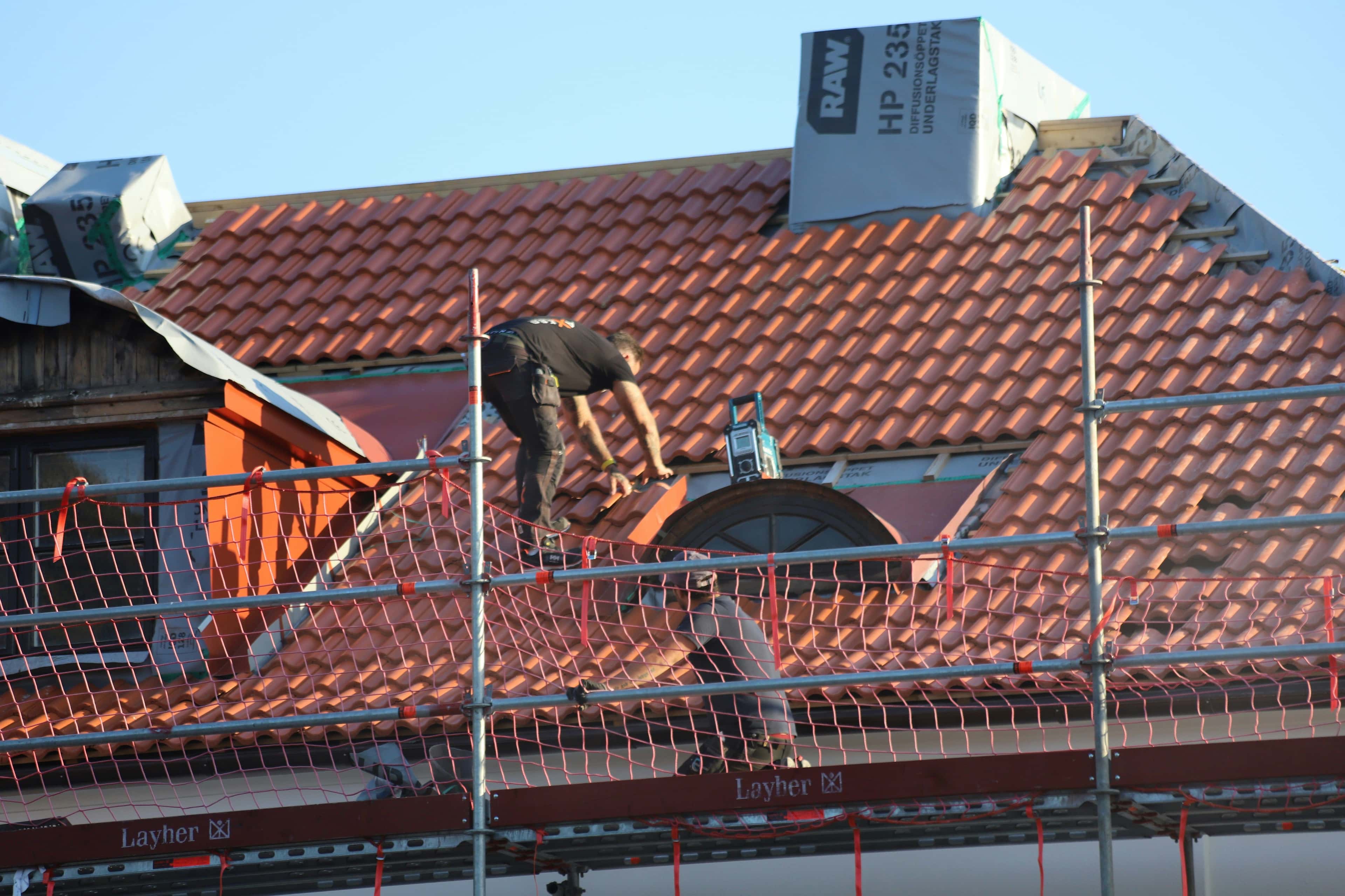a man working on a roof