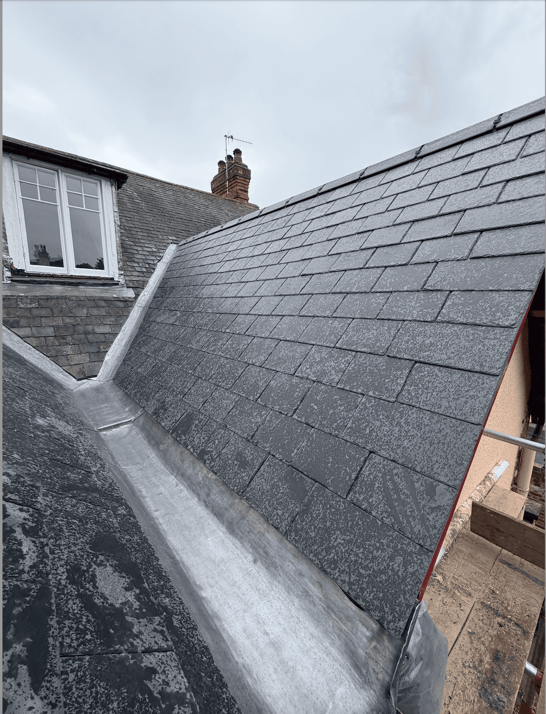 View across Nottingham rooftops from scaffolding on a newly tiled roof